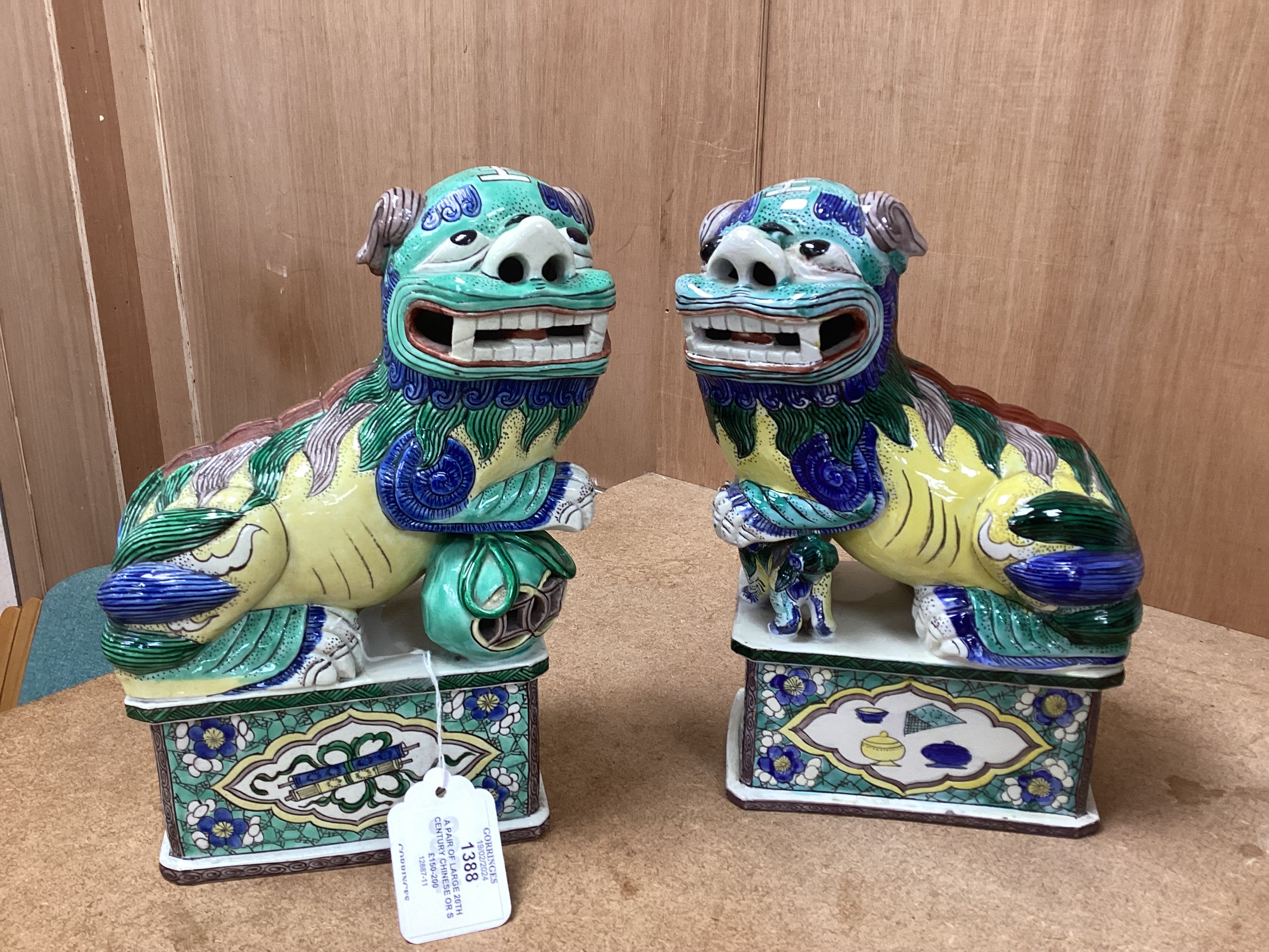 A pair of large 20th century Chinese or Samson enamelled porcelain figures of Buddhist Lions, 24cm